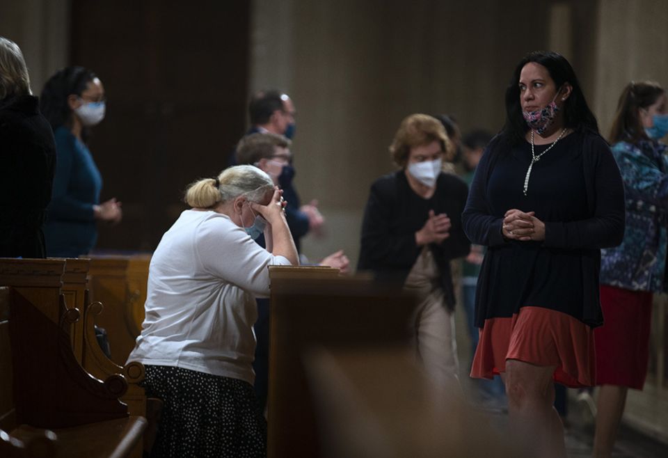 People receive Communion during Mass at the Basilica of the National Shrine of the Immaculate Conception in Washington, D.C., March 11, 2021. (CNS/Tyler Orsburn)