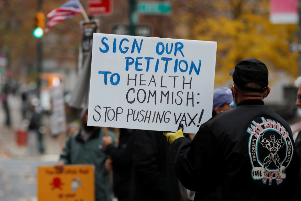 Protesters demonstrate outside the New York City Department of Health offices after New York City Mayor Bill de Blasio announced Dec. 6, 2021, that all employers in the private sector must implement COVID-19 vaccine mandates for their workers in New York 