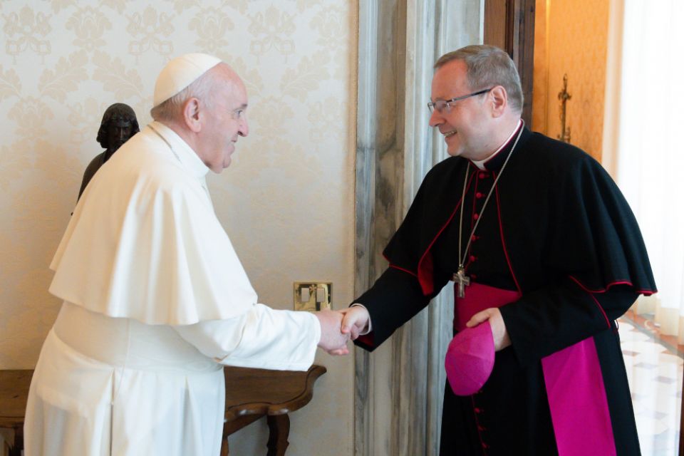 Pope Francis greets Bishop Georg Bätzing, president of the German bishops' conference, during an audience at the Vatican June 24, 2021. (CNS/Vatican Media)