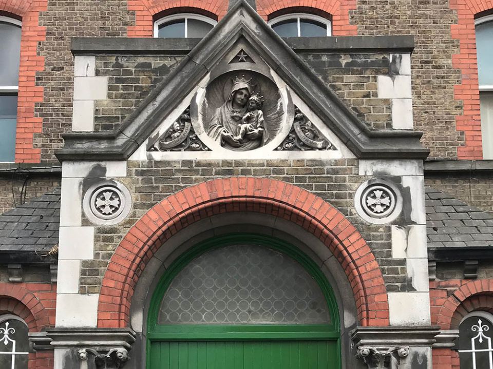 The archway above the entrance to Our Lady of Charity, the now-derelict Magdalene laundry on Sean McDermott Street in Dublin (Sarah Mac Donald)