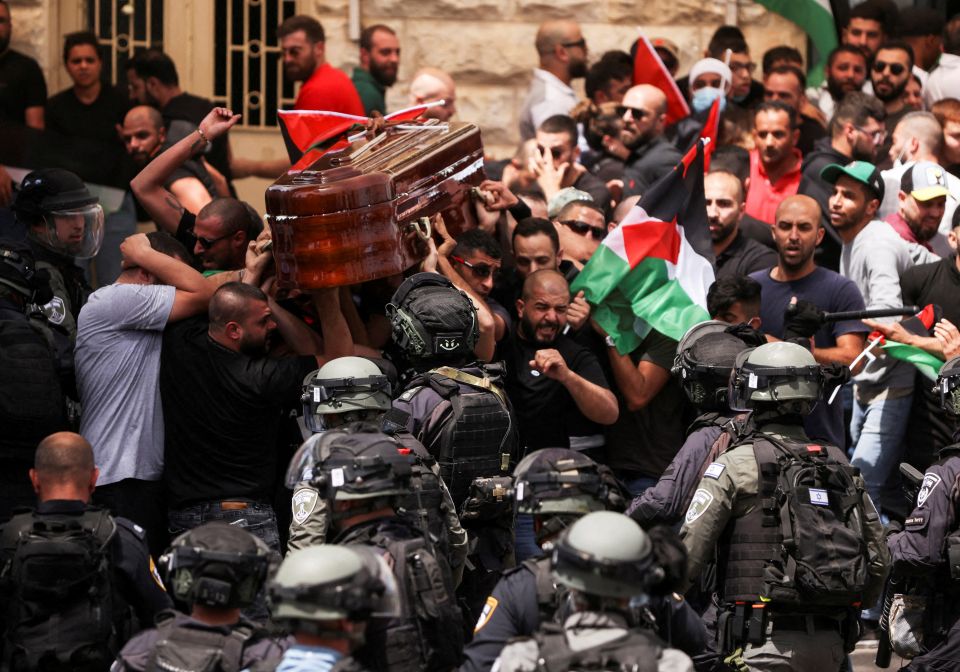 Israeli riot police scuffle with mourners carrying the casket of Al-Jazeera journalist Shireen Abu Akleh during a procession in Jerusalem's Old City May 13, 2022. (CNS photo/Ammar Awad, Reuters)