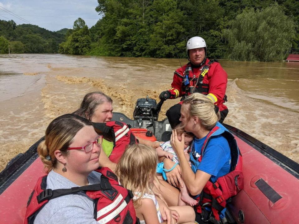A rescue team member evacuates residents from their homes by boat through flooded Breathitt County streets in Kentucky July 28, 2022. (CNS photo/Wolfe County Search & Rescue Team via Reuters)