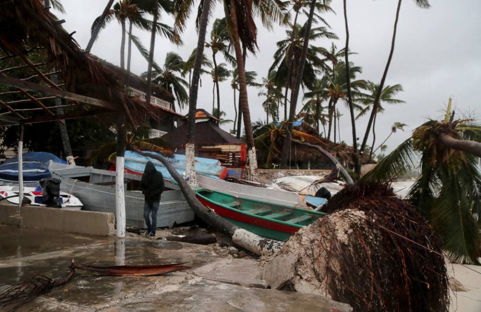 A person walks amid debris on the seashore in the aftermath of Hurricane Fiona in Punta Cana, Dominican Republic, Sept. 19, 2022. (CNS photo/Ricardo Rojas, Reuters)